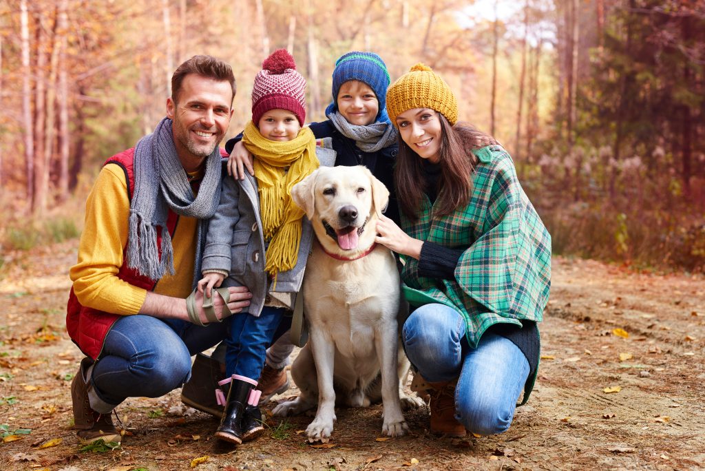 Family with kids and dog wearing cozy fall outfits | outdoor family photographer Durham NC